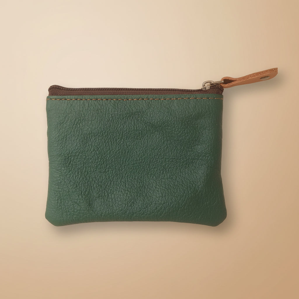 Green leather pouch with a zipper on a light gray background