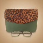 Leopard print and green glasses case on a white background