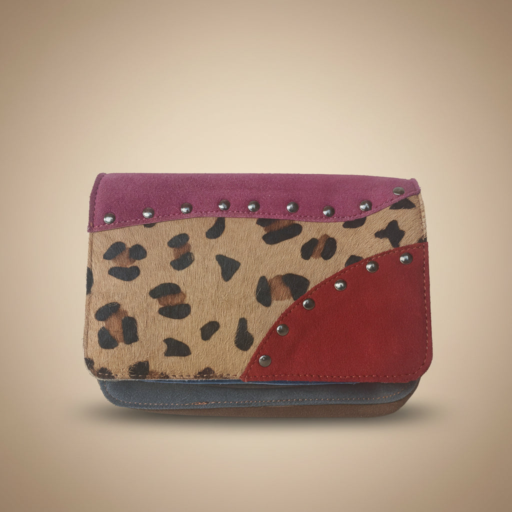Leopard print wallet with red and pink accents on a white background