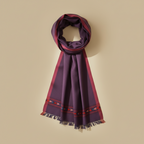 Purple scarf with red and blue patterns on a beige background