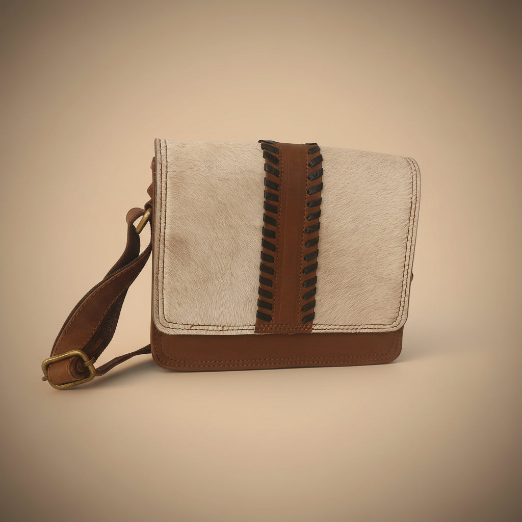 Small leather bag with brown and black accents on a white background