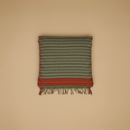 Striped fabric with red and green pattern on a beige background