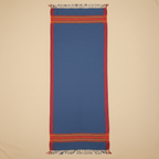 Blue woven fabric with red and orange stripes on a beige background