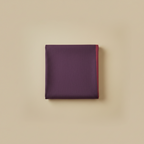 Folded purple fabric on a beige background