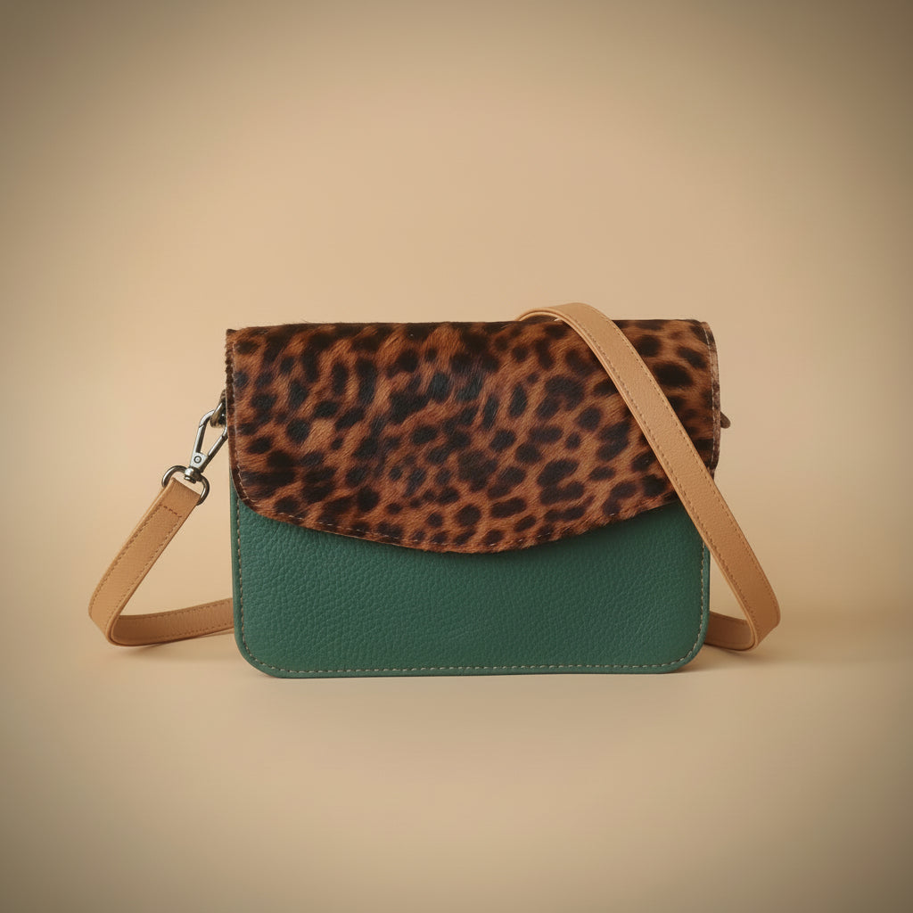 Leopard print wallet and green leather wallet on a white background